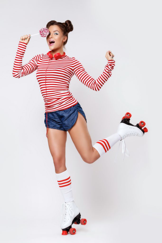 Beautiful,Woman,In,The,Roller-skates,And,With,Red,Headphones,And